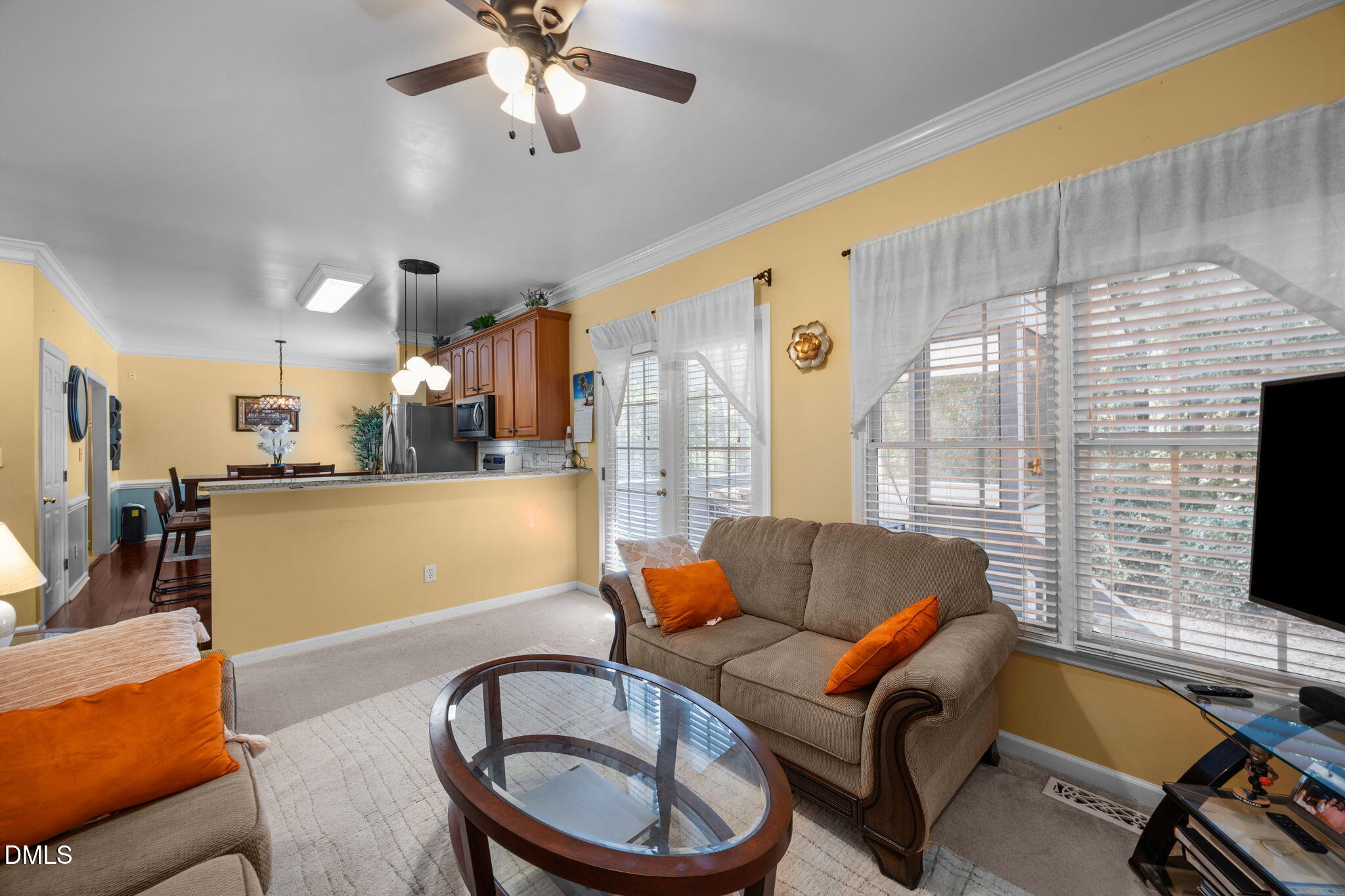 1758 Rowsby Court Wake Forest, NC 27587 - Photo 16 of 48 a living room with furniture a flat screen tv and a fireplace
