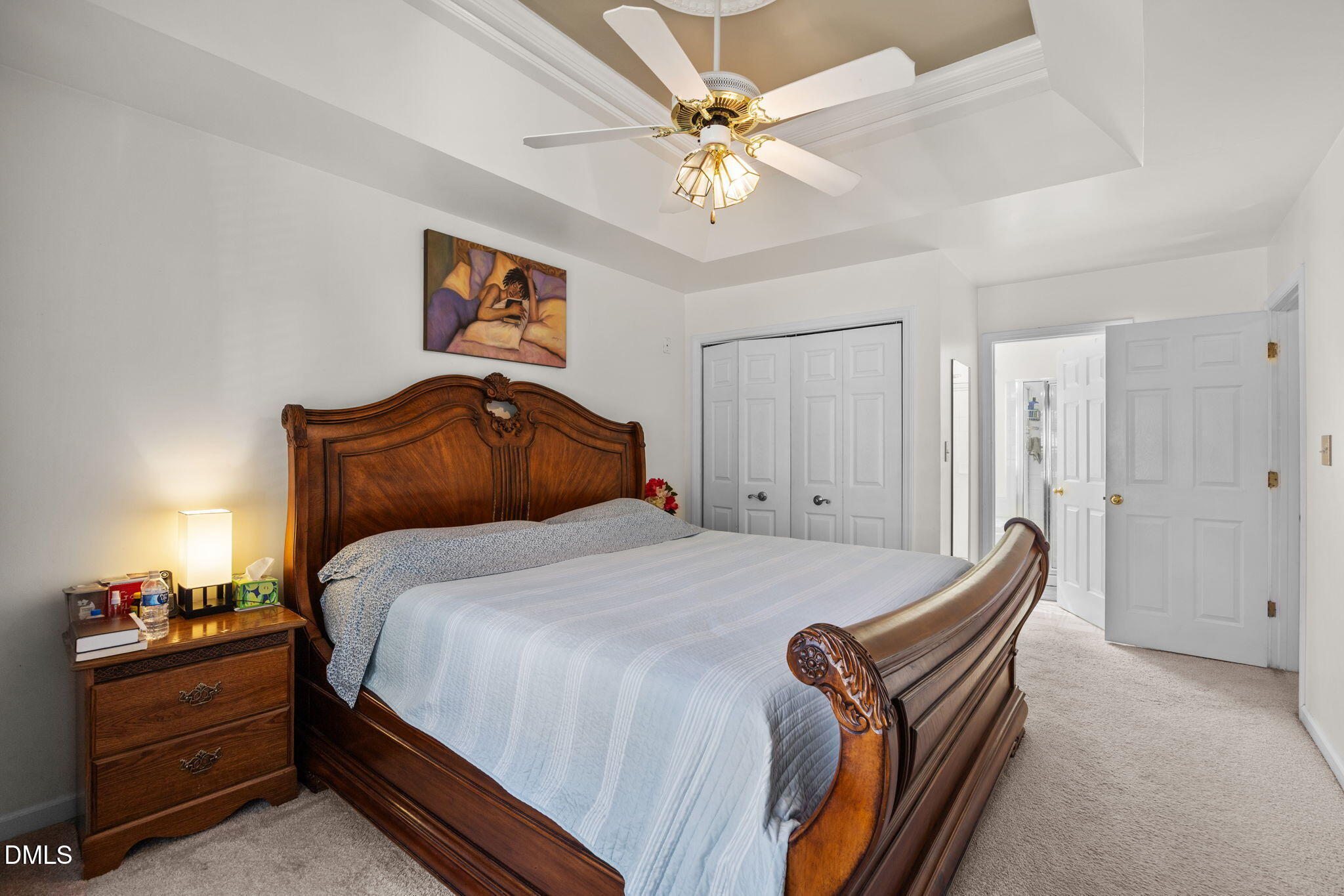 1758 Rowsby Court Wake Forest, NC 27587 - Photo 22 of 48 a bedroom with bed and a chandelier