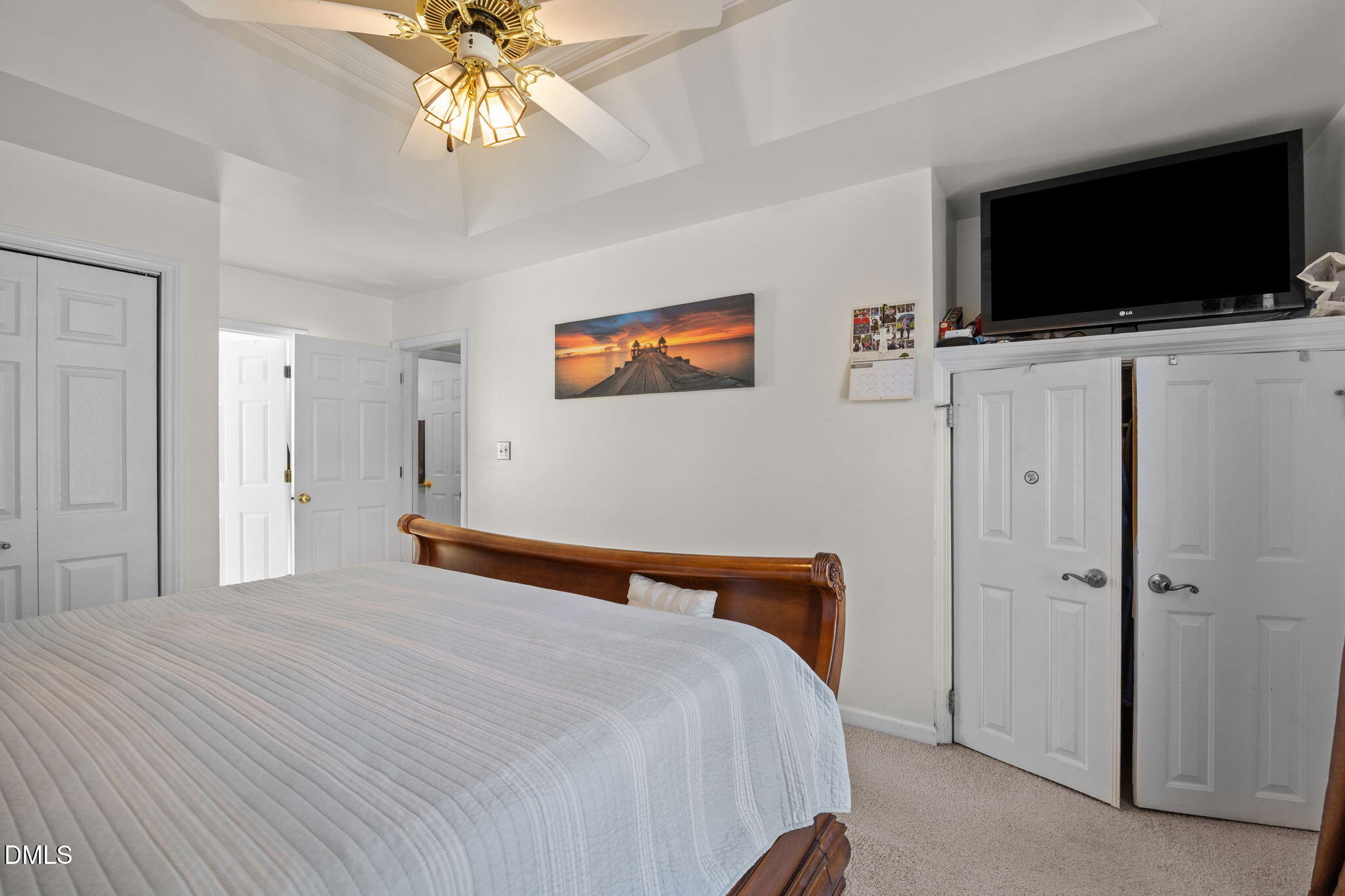 1758 Rowsby Court Wake Forest, NC 27587 - Photo 23 of 48 a bedroom with a bed and a flat screen tv