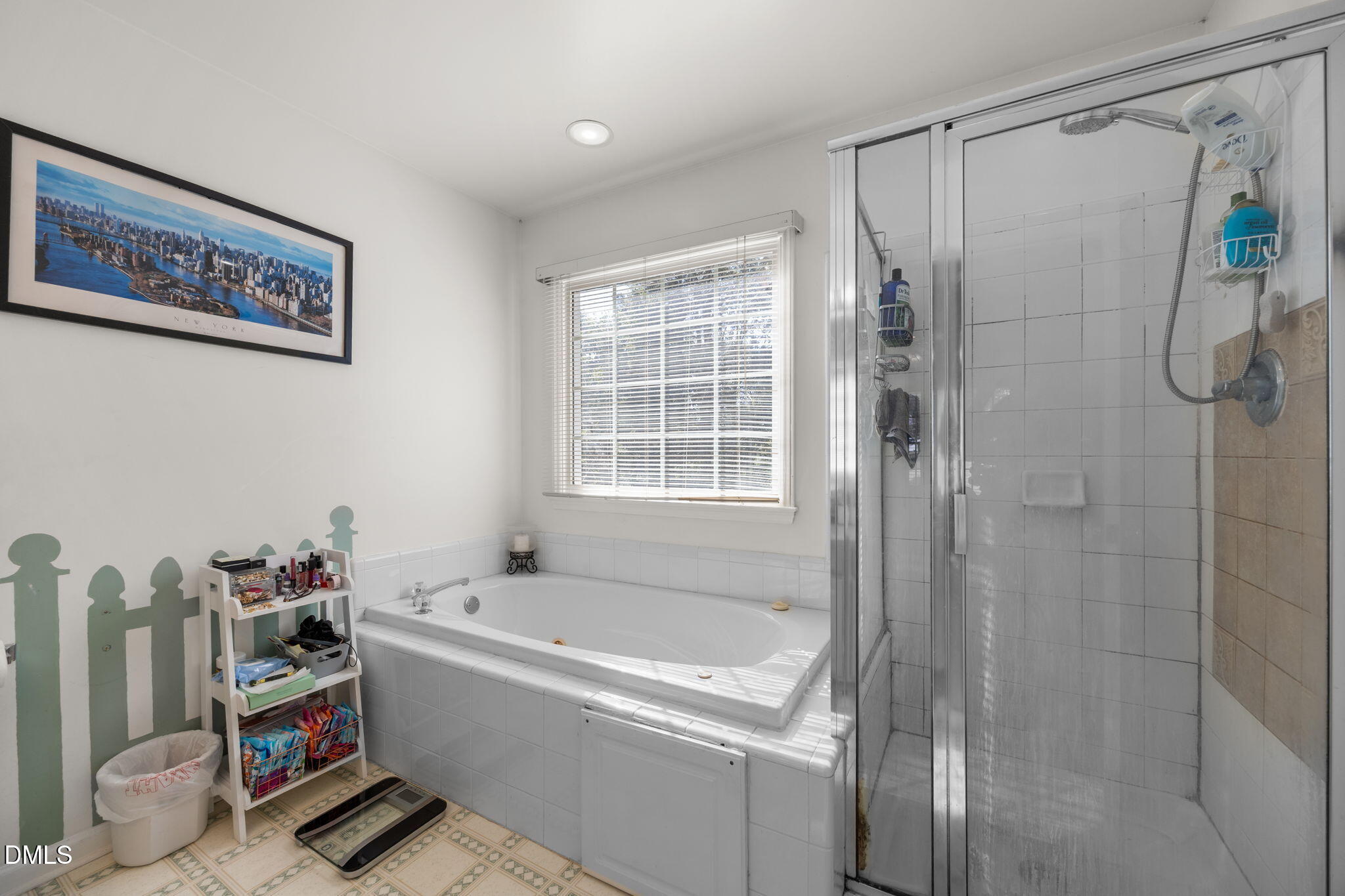 1758 Rowsby Court Wake Forest, NC 27587 - Photo 24 of 48 a bathroom with a bathtub and a shower