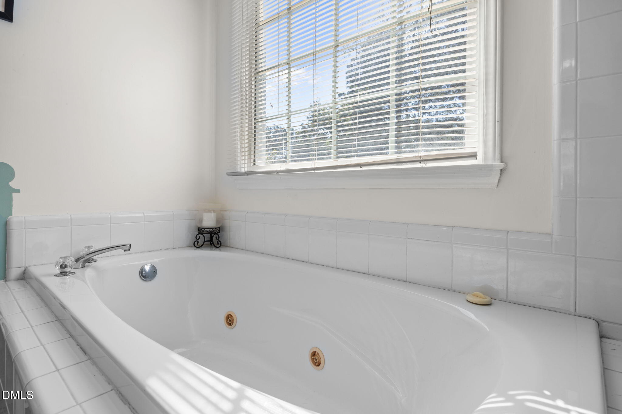 1758 Rowsby Court Wake Forest, NC 27587 - Photo 25 of 48 a bath tub sitting in a bathroom next to a window