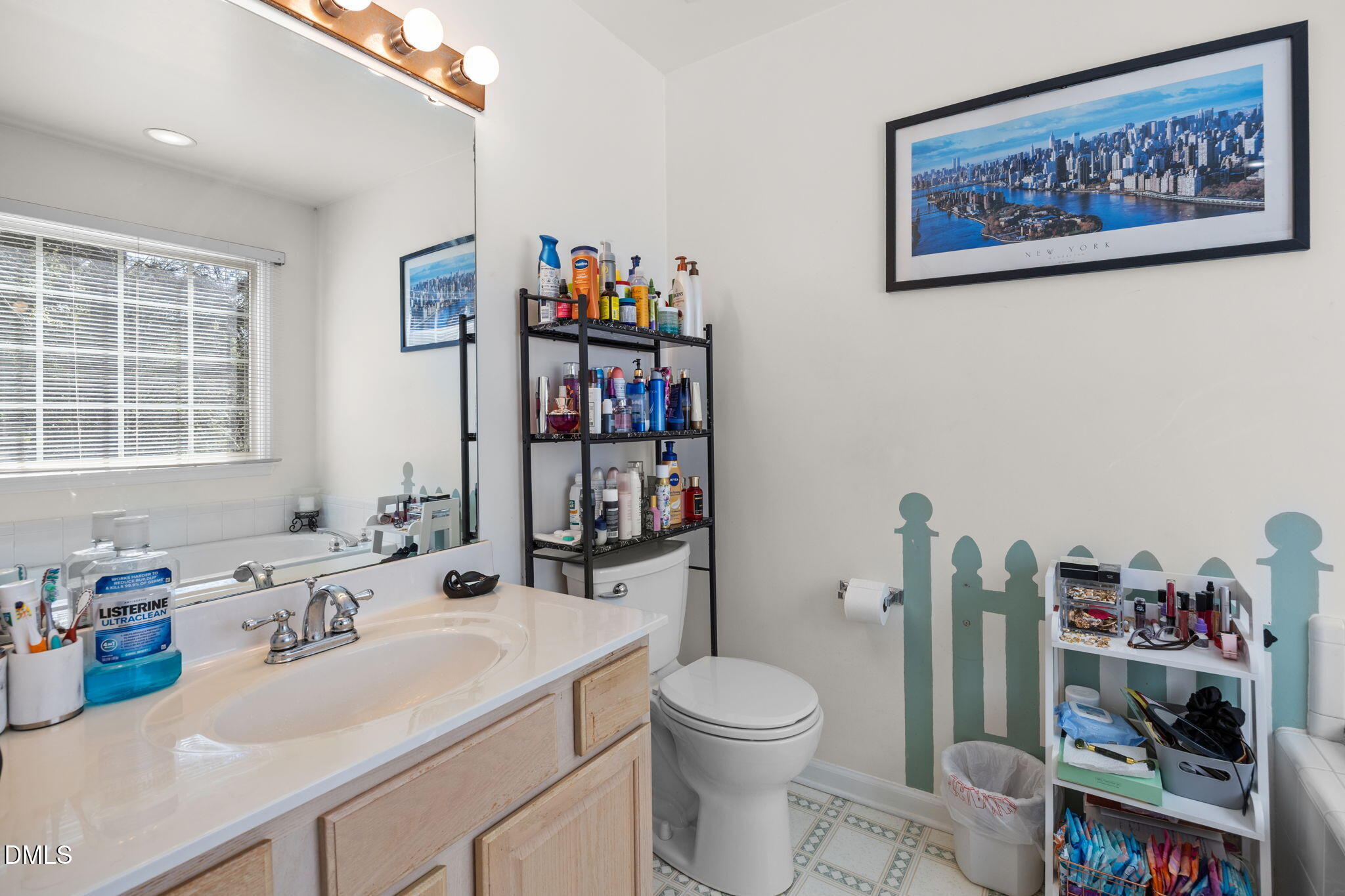 1758 Rowsby Court Wake Forest, NC 27587 - Photo 26 of 48 a bathroom with a sink a toilet and a large mirror