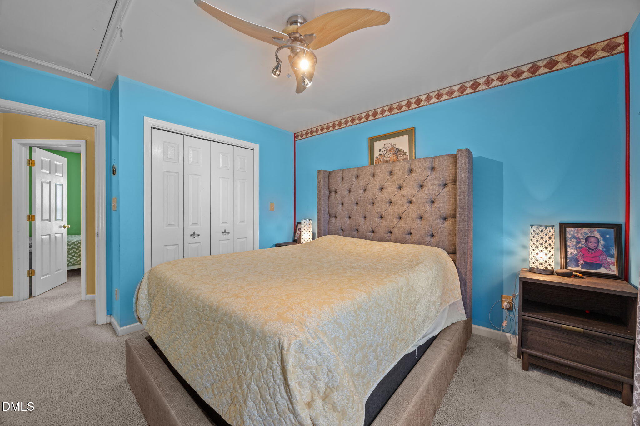 1758 Rowsby Court Wake Forest, NC 27587 - Photo 28 of 48 a bedroom with a bed and a chandelier
