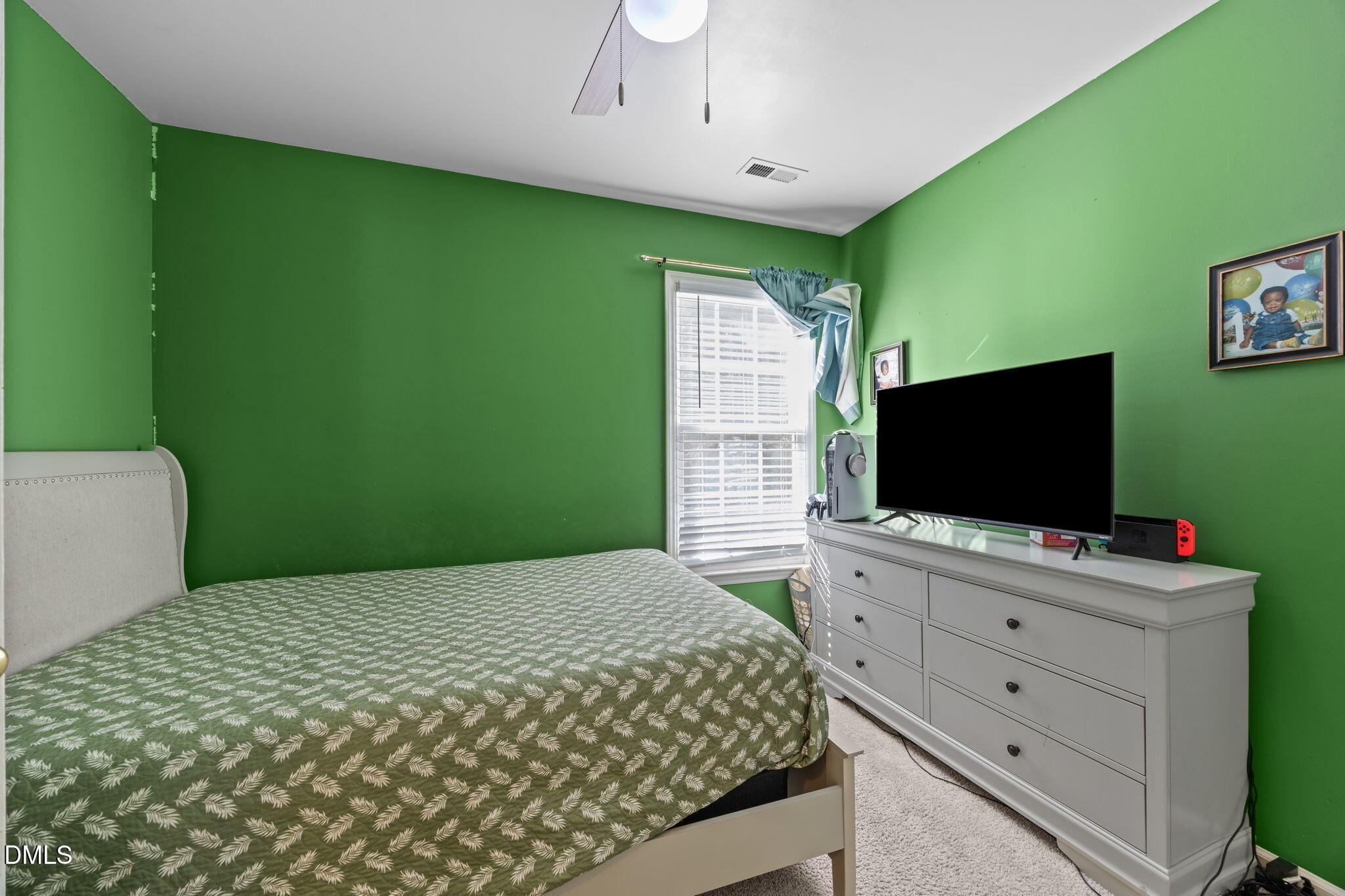 1758 Rowsby Court Wake Forest, NC 27587 - Photo 29 of 48 a bedroom with a bed and a flat screen tv