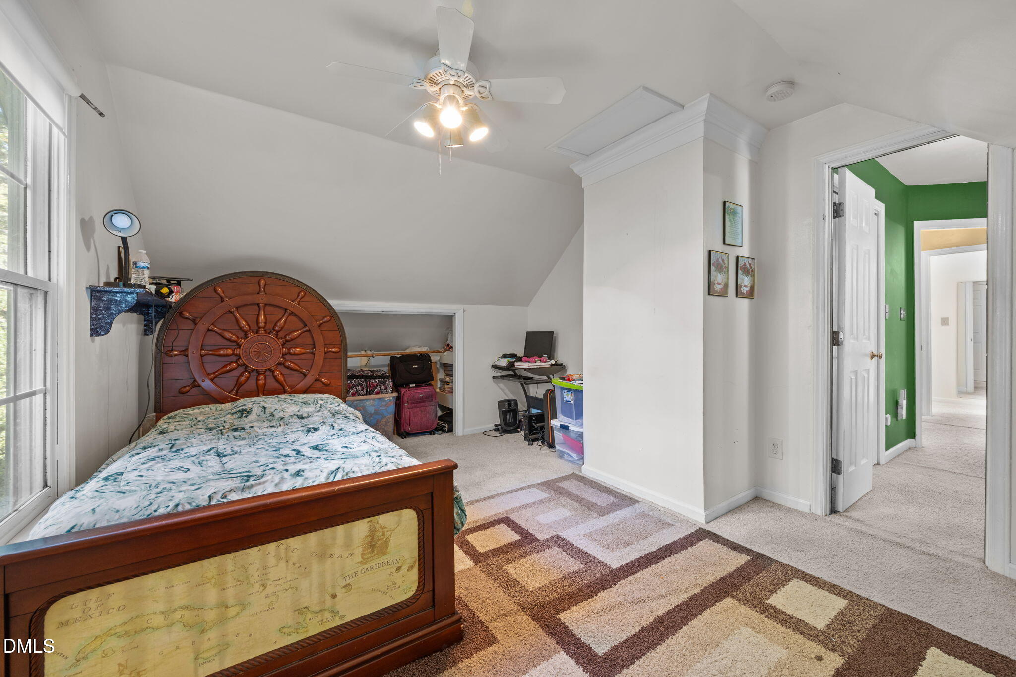 1758 Rowsby Court Wake Forest, NC 27587 - Photo 30 of 48 a bedroom with a bed window and a chandelier