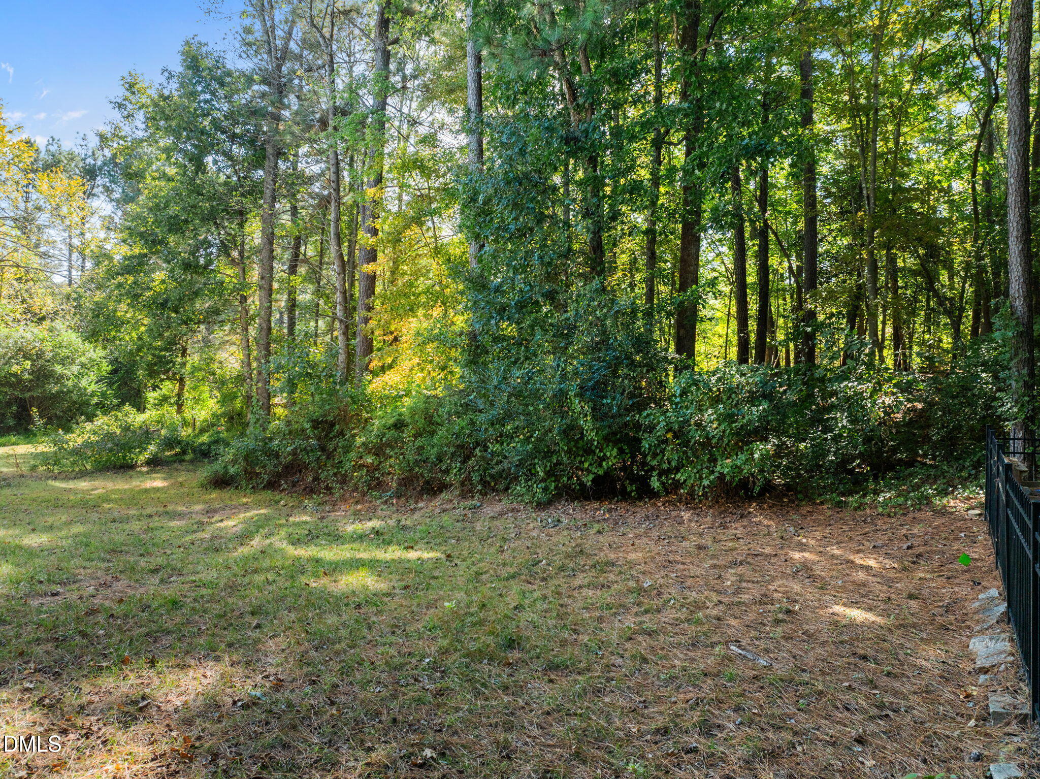 1758 Rowsby Court Wake Forest, NC 27587 - Photo 40 of 48 a view of a field with trees in the background