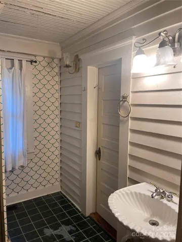 a bathroom with a double vanity sink and mirror