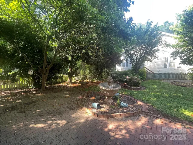 a view of a yard next to a house