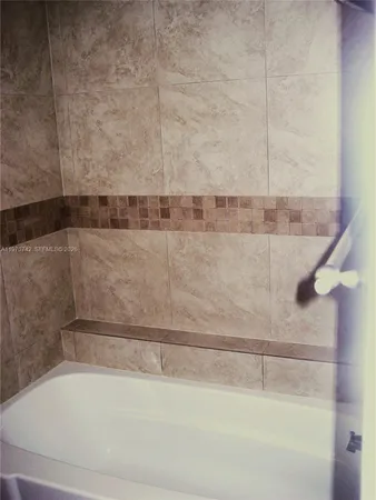 a bathroom with a bathtub