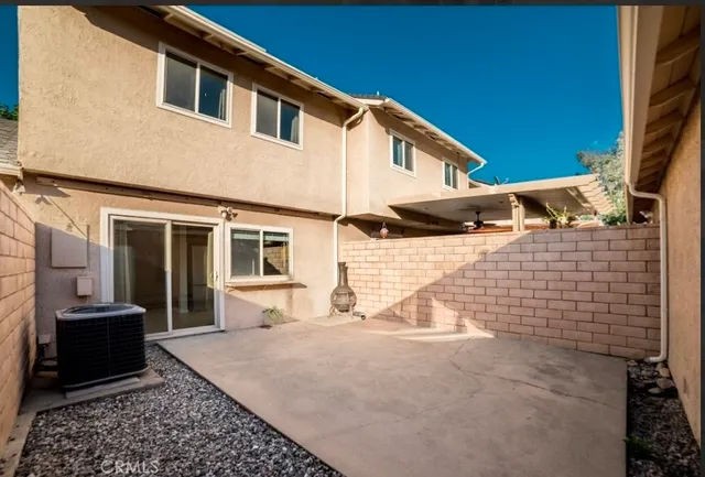 a view of a house with a barbeque