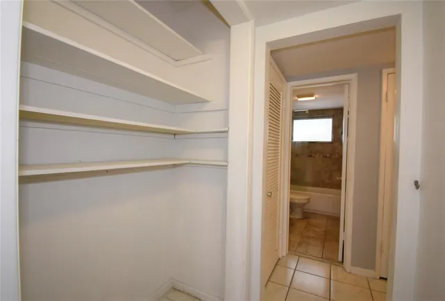 a room with a desk and a window