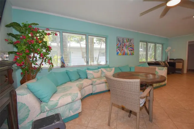 a view of a room that has a couch and a table in it