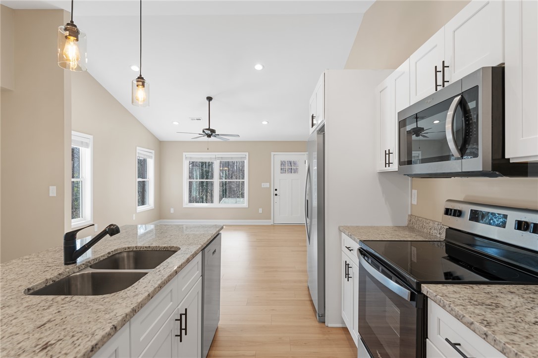 505 Hillside Drive Walhalla, SC 29691 - Photo 11 of 31 This bright kitchen with a spacious island flows into an open living area, perfect for daily life.
