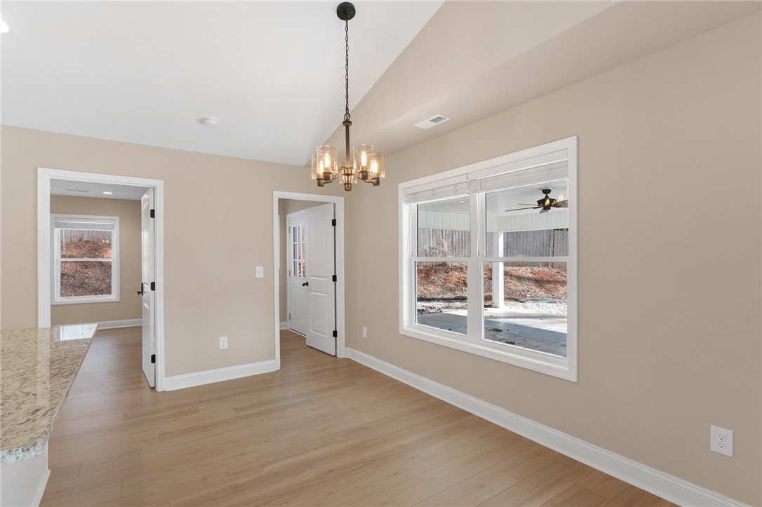 505 Hillside Drive Walhalla, SC 29691 - Photo 12 of 31 This bright interior features durable flooring and ample natural light, ideal for everyday living and entertaining.