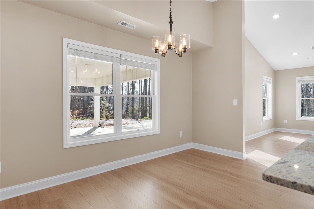 505 Hillside Drive Walhalla, SC 29691 - Photo 13 of 31 This bright space features natural light, high ceilings, and durable flooring for modern living.