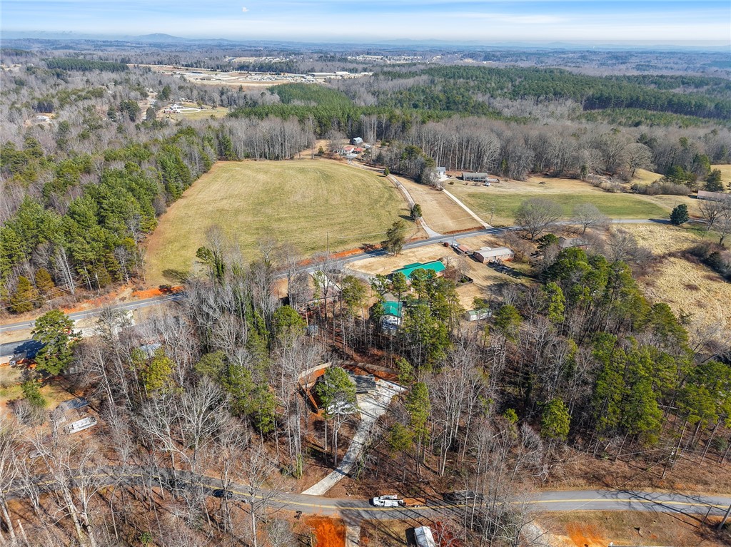 505 Hillside Drive Walhalla, SC 29691 - Photo 28 of 31 This expansive aerial view showcases a vibrant green landscape with abundant natural surroundings.
