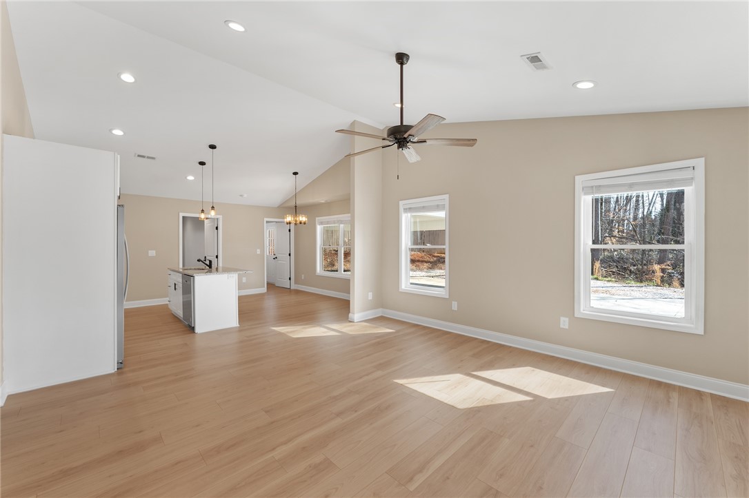 505 Hillside Drive Walhalla, SC 29691 - Photo 6 of 31 Bright and airy open-concept space featuring modern flooring and ample natural light.
