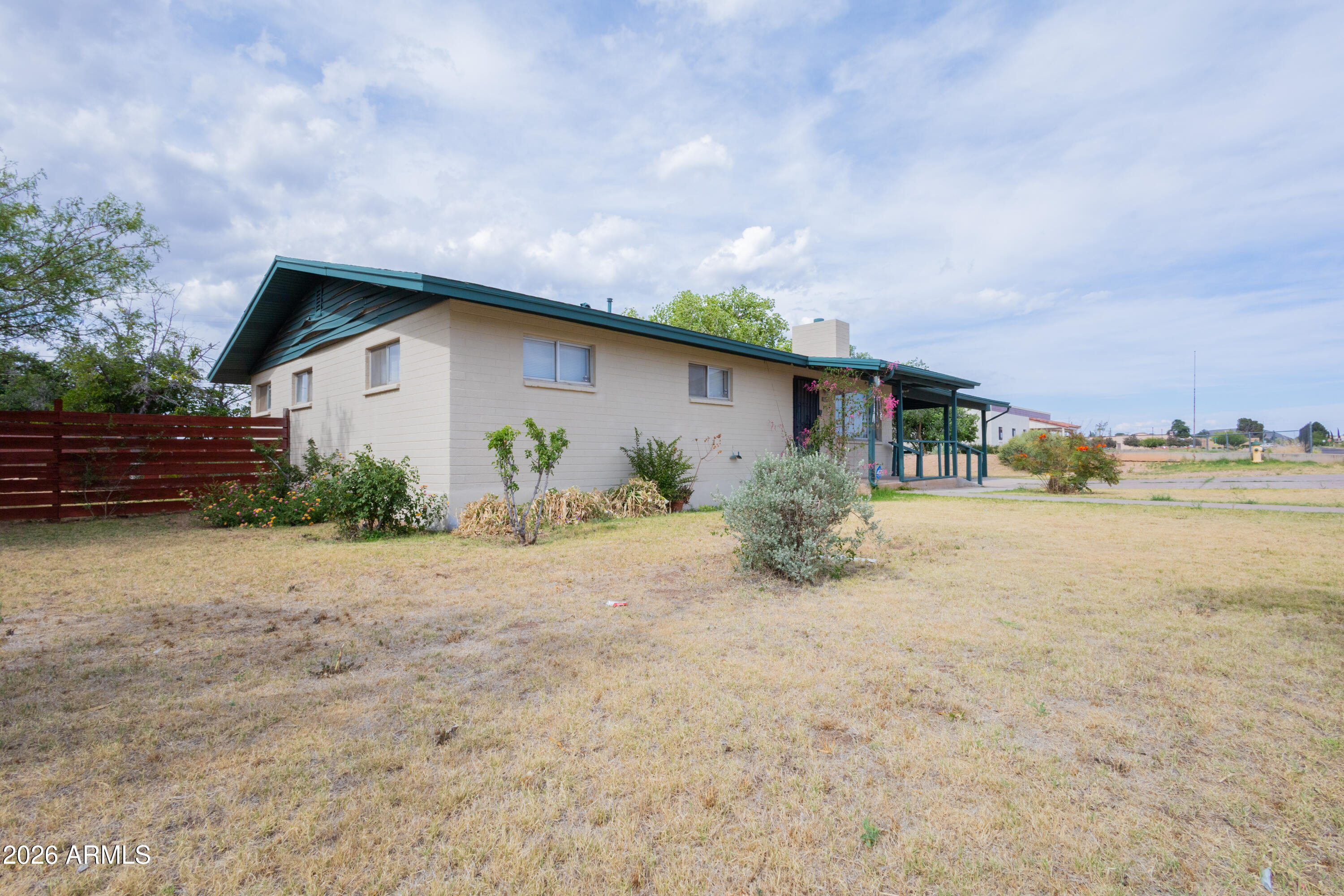 1626 11th Street Douglas, AZ 85607 - Photo 2 of 30 a view of a house with backyard and plants