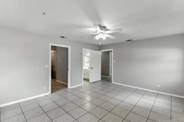 a view of an empty room with windows