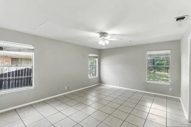 a bathroom with a tub a sink and mirror