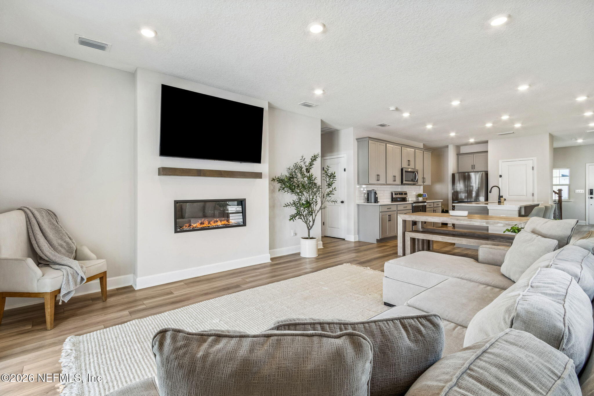95057 Terris Way Fernandina Beach, FL 32034 - Photo 10 of 43 a living room with furniture and a flat screen tv