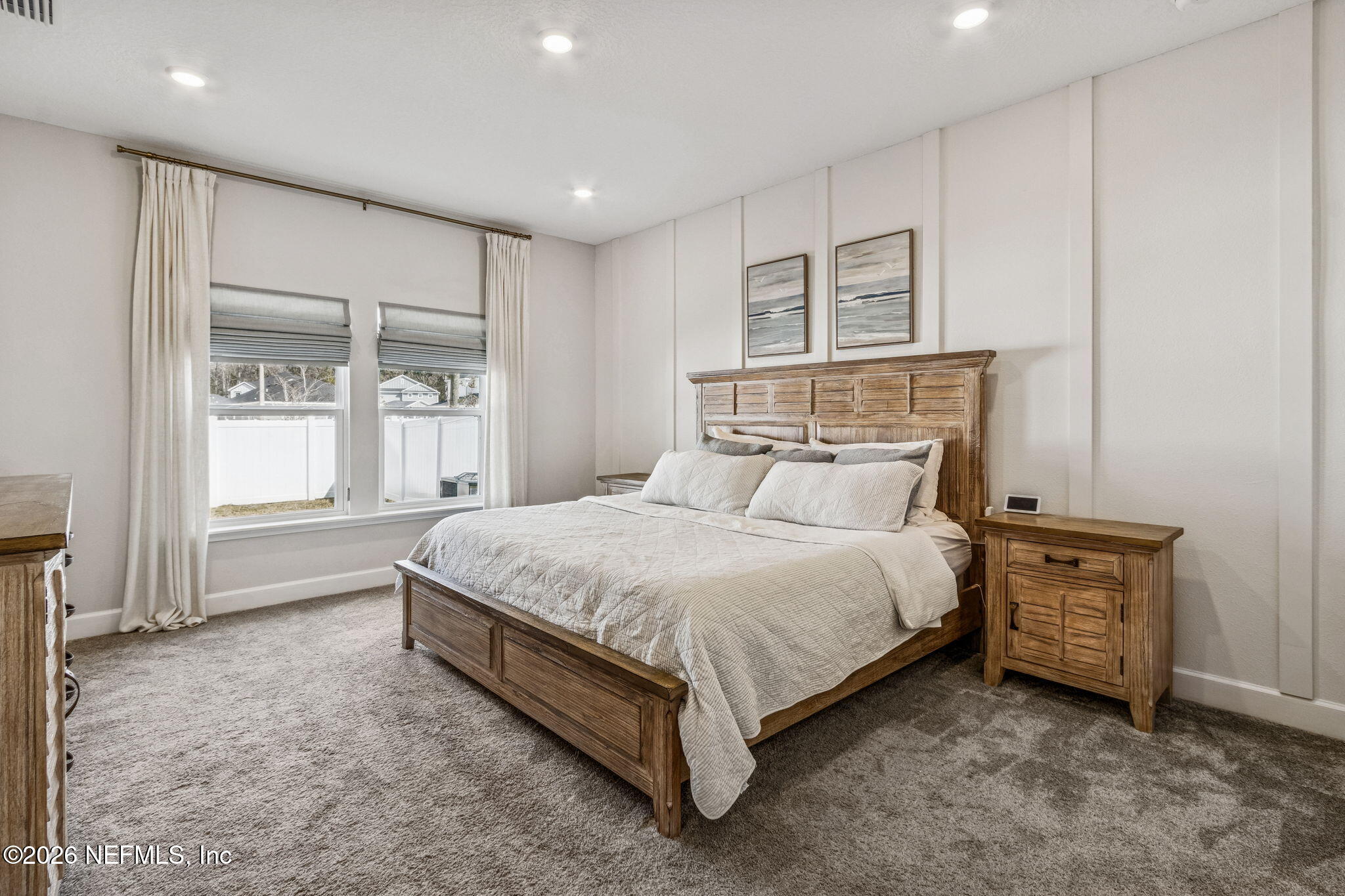 95057 Terris Way Fernandina Beach, FL 32034 - Photo 16 of 43 a bed sitting in a spacious bedroom next to a window