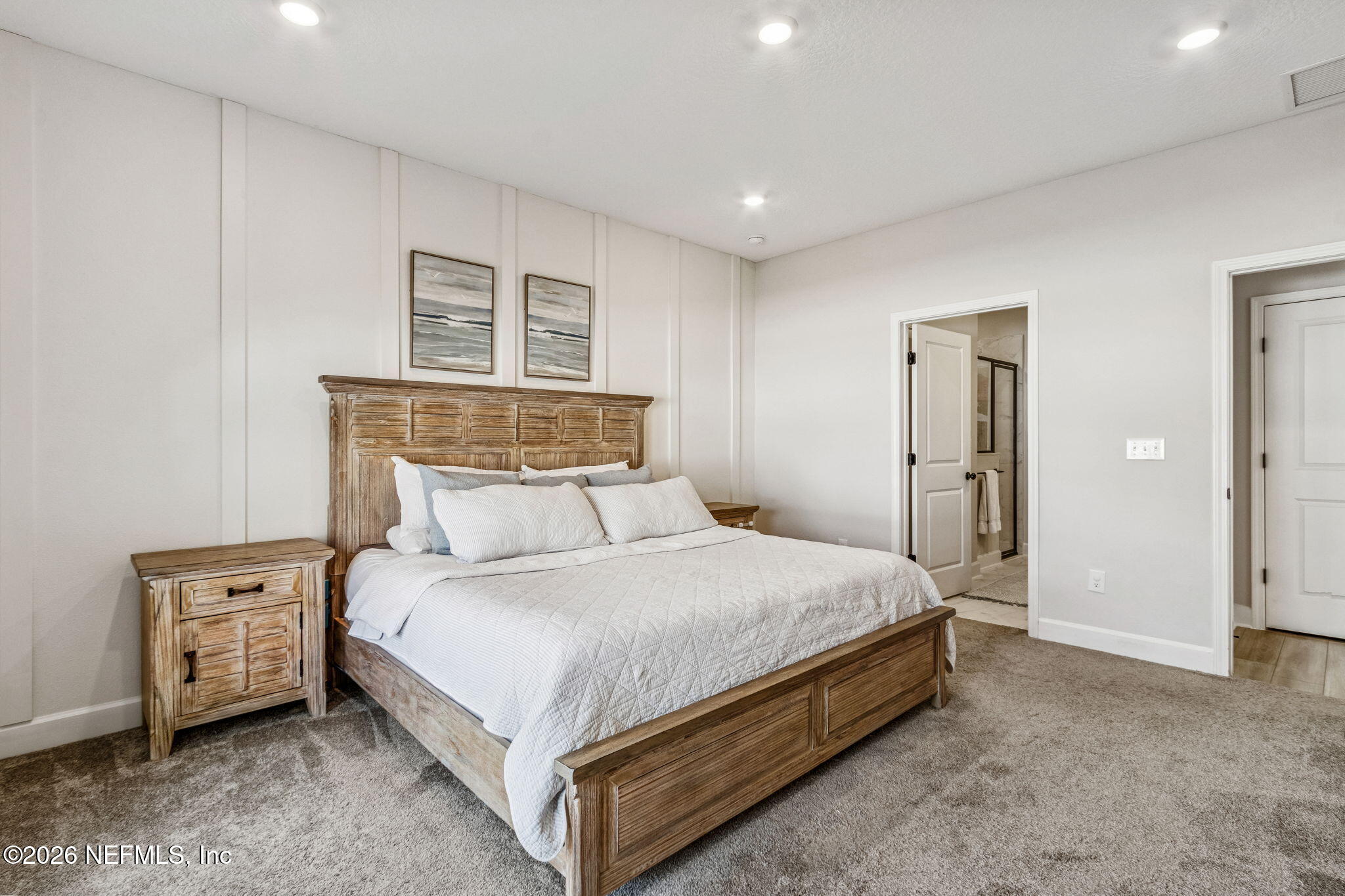 95057 Terris Way Fernandina Beach, FL 32034 - Photo 18 of 43 a large bed sitting in a bedroom and table