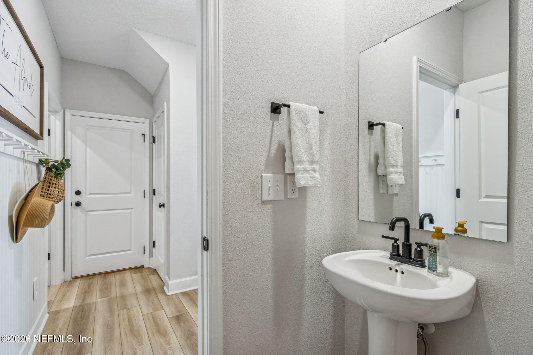95057 Terris Way Fernandina Beach, FL 32034 - Photo 25 of 43 a bathroom with a sink a mirror and shower