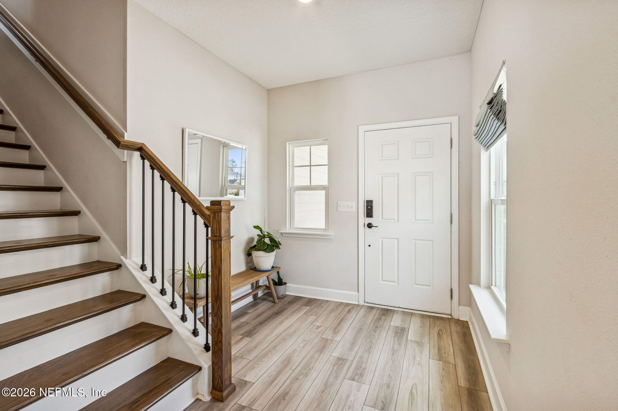 95057 Terris Way Fernandina Beach, FL 32034 - Photo 27 of 43 a view of a hallway with wooden floor and entryway