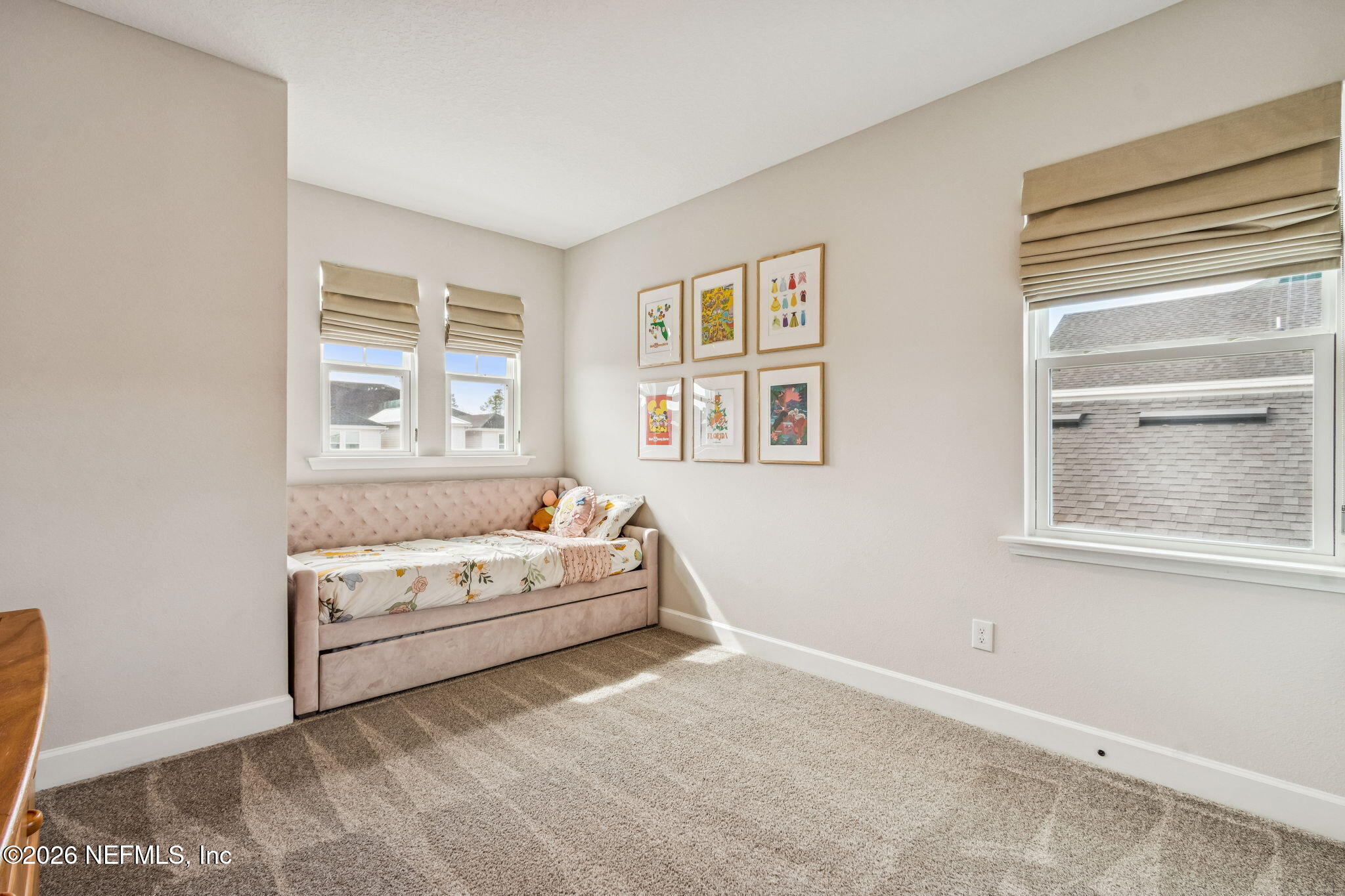 95057 Terris Way Fernandina Beach, FL 32034 - Photo 31 of 43 a white bed sitting in a bedroom next to a window