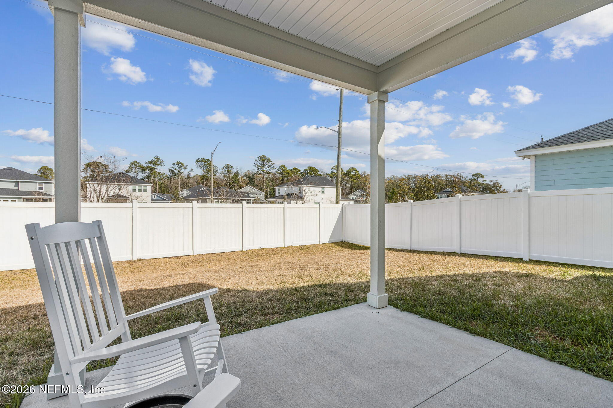 95057 Terris Way Fernandina Beach, FL 32034 - Photo 39 of 43 a view of a chair and tables in the yard