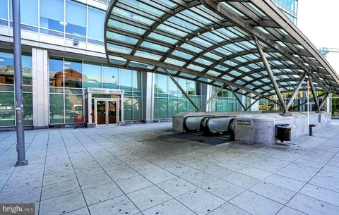 a view of a porch with furniture and a yard