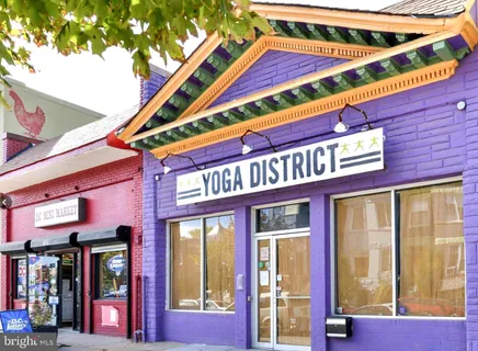 a front view of a building with large windows