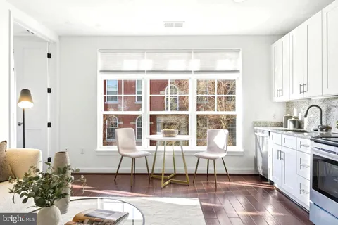 a living room with furniture a fireplace and a table