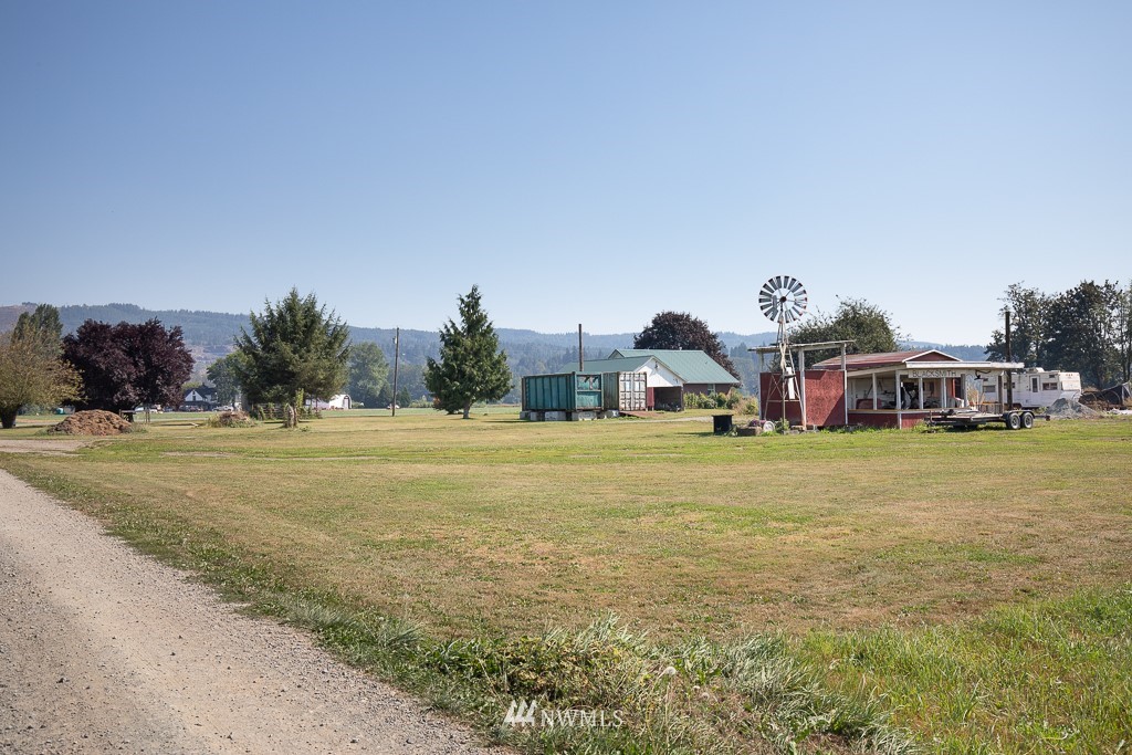 19528 Tualco Loop Road Monroe, WA 98272 - Photo 22 of 24 a front view of house with yard and trees in the background