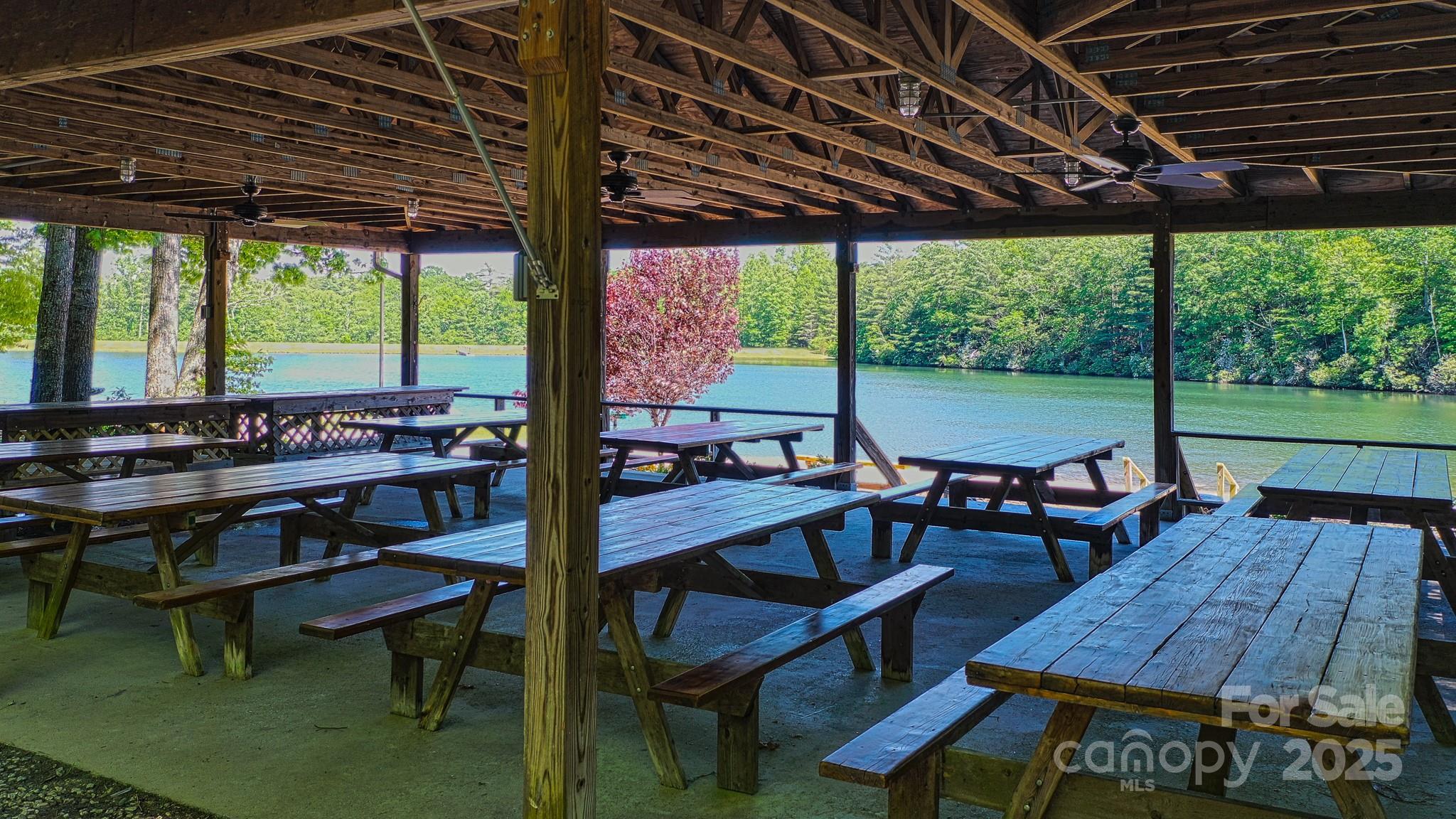 Tbd McHone Road Spruce Pine, NC 28777 - Photo 18 of 18 a view of a patio with table and chairs under an umbrella with a small yard