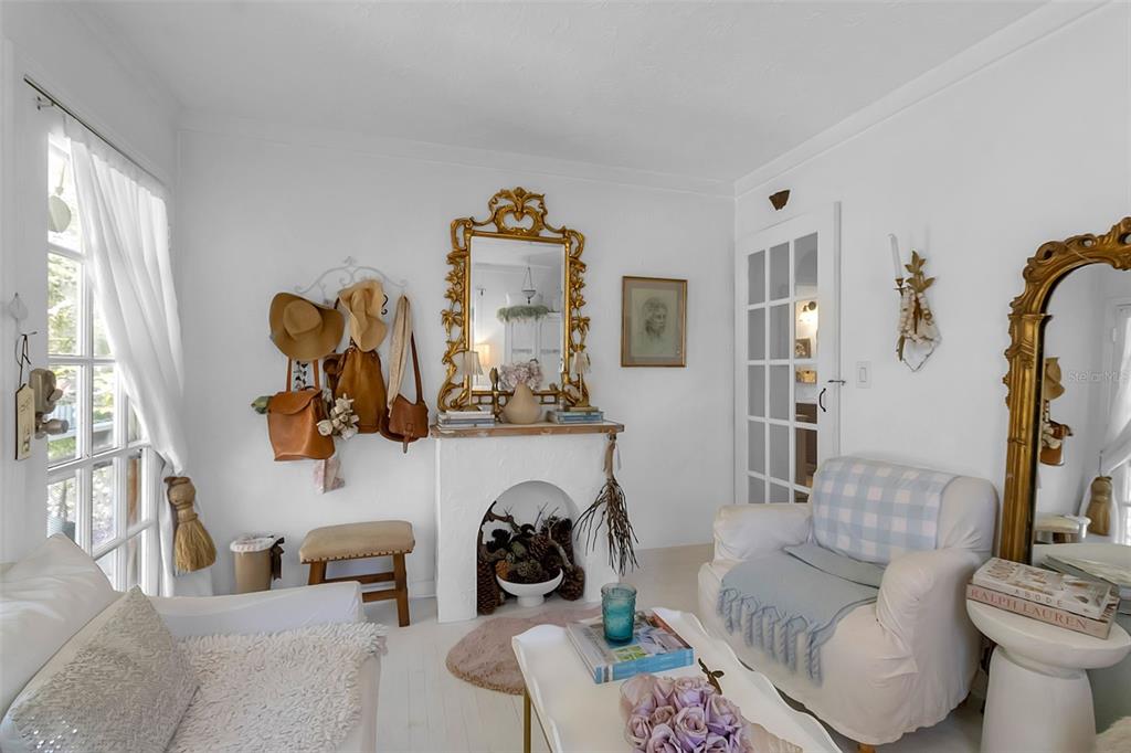 2562 Ashton Road Sarasota, FL 34231 - Photo 13 of 30 a living room with furniture and a fireplace