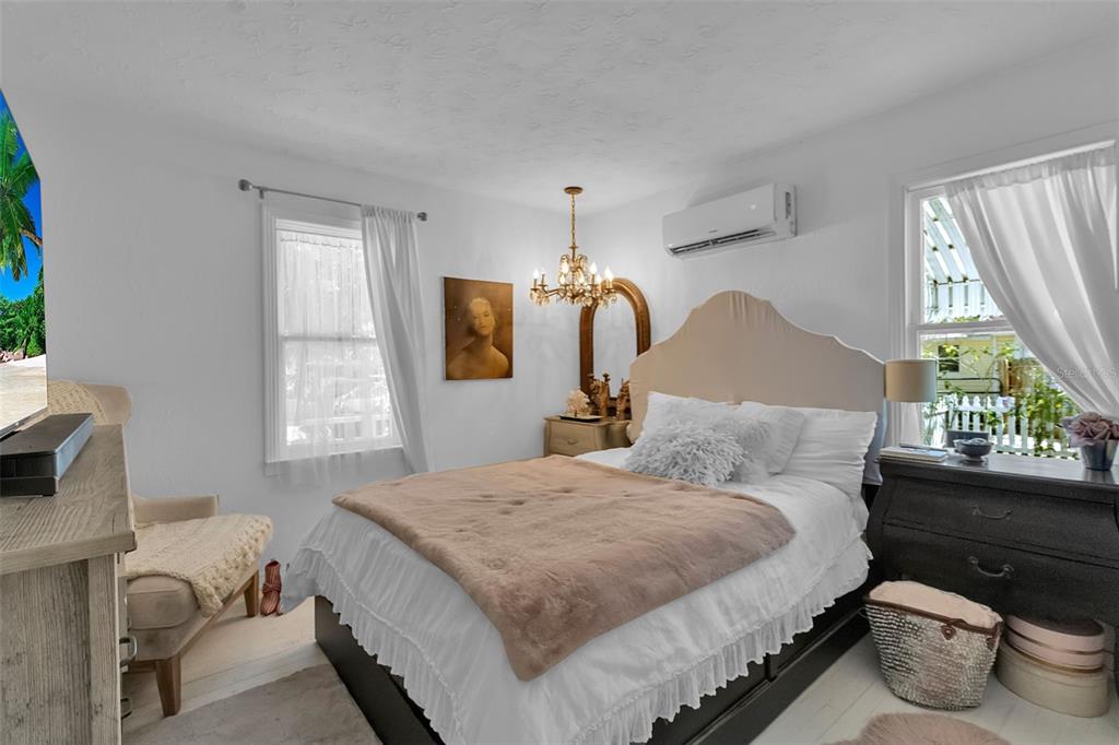 2562 Ashton Road Sarasota, FL 34231 - Photo 20 of 30 a bedroom with a bed and a window