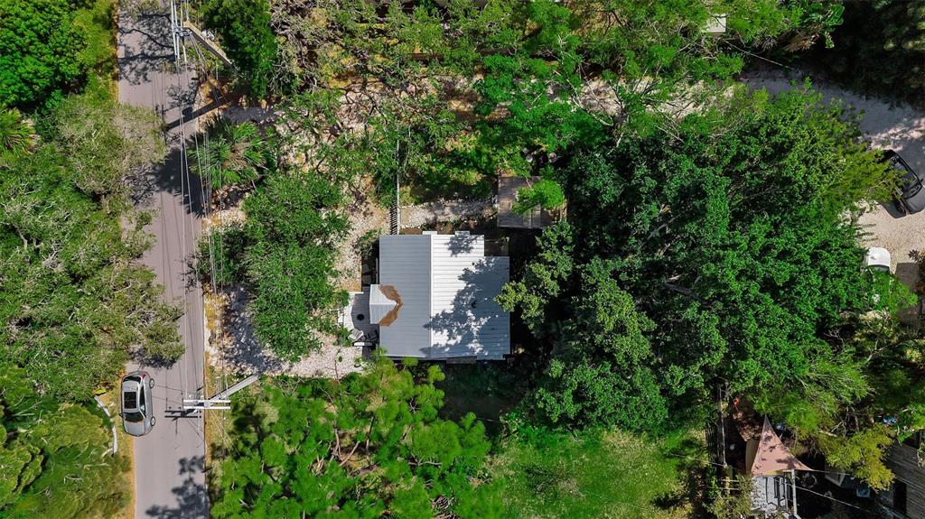 2562 Ashton Road Sarasota, FL 34231 - Photo 28 of 30 an aerial view of a house with a yard and large trees