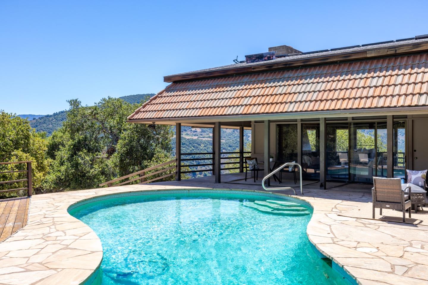 9 De Amaral Road Carmel Valley, CA 93924 - Photo 1 of 17 a view of a house with backyard porch and sitting area