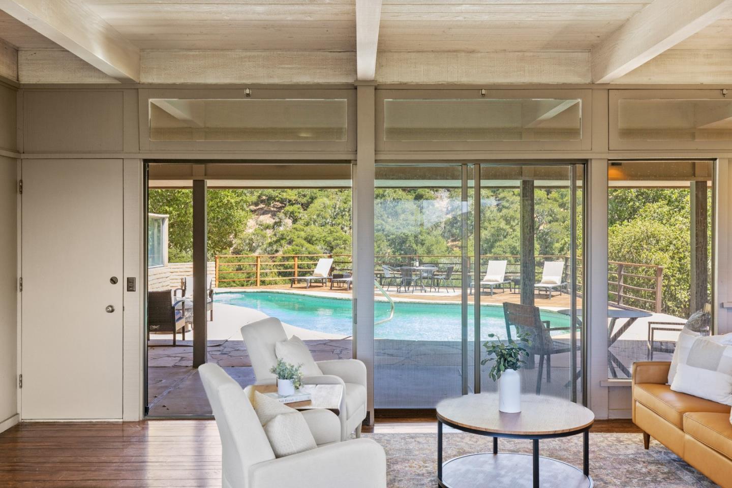 9 De Amaral Road Carmel Valley, CA 93924 - Photo 12 of 17 a living room with furniture and a window