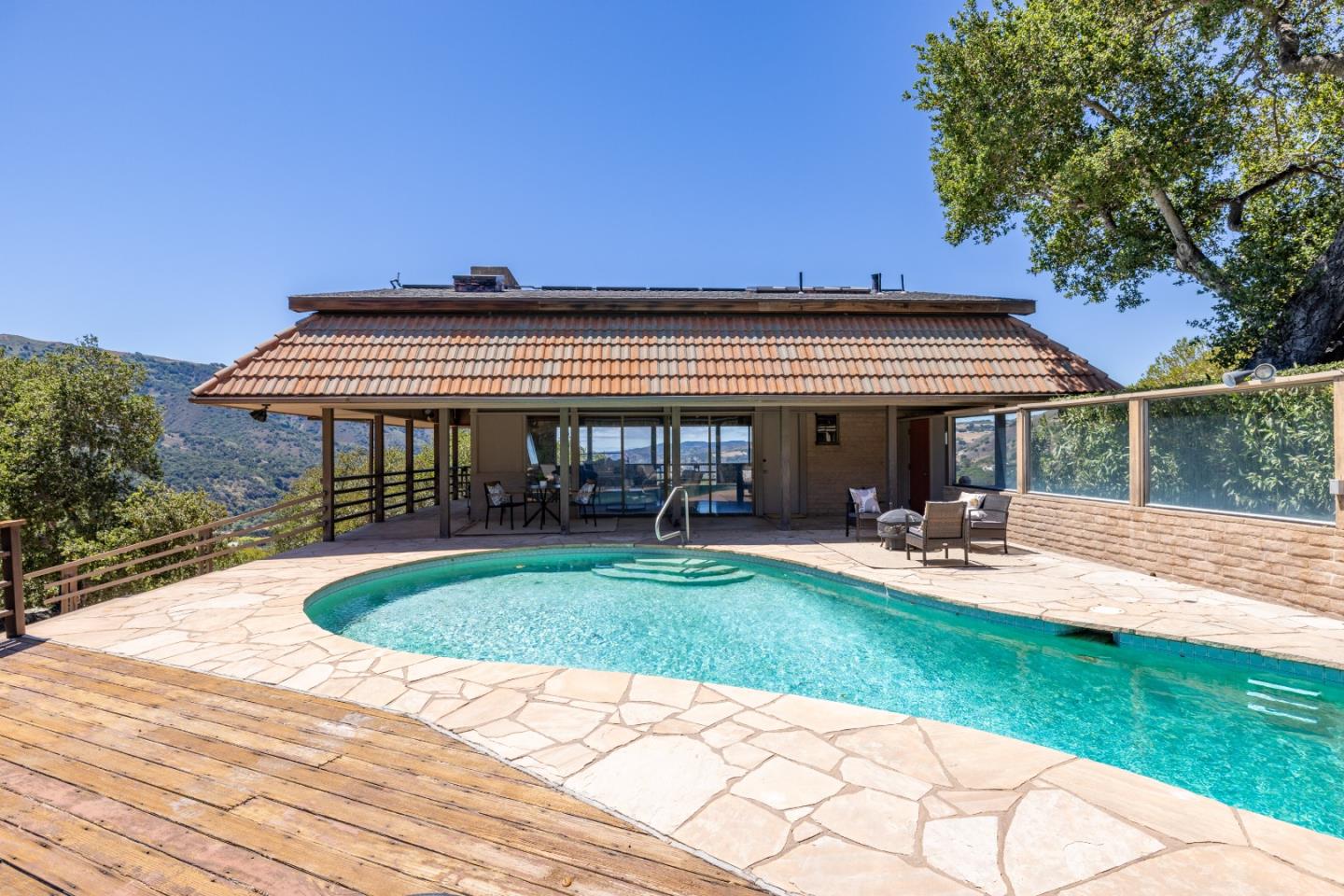 9 De Amaral Road Carmel Valley, CA 93924 - Photo 13 of 17 a view of house with outdoor seating area
