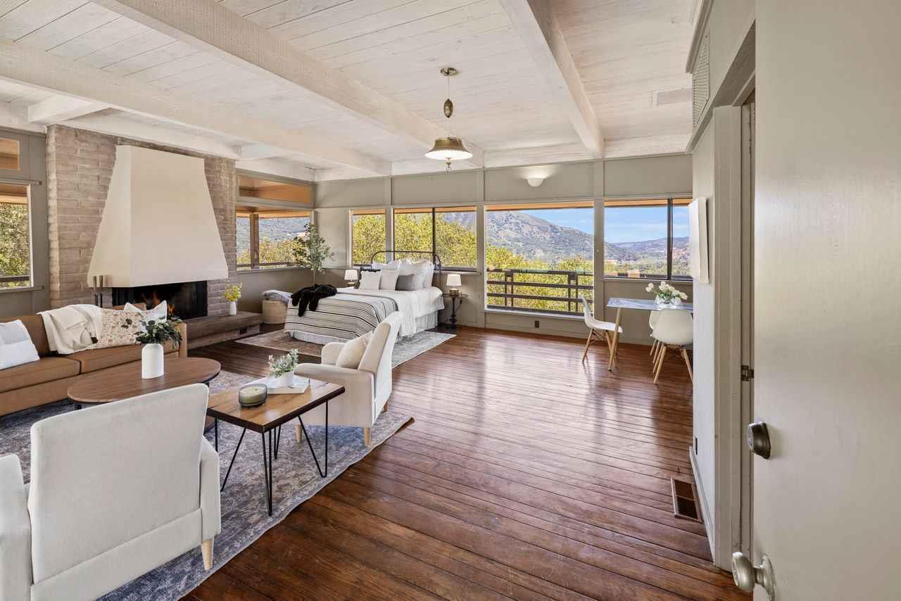 9 De Amaral Road Carmel Valley, CA 93924 - Photo 5 of 17 a living room with furniture and a large window