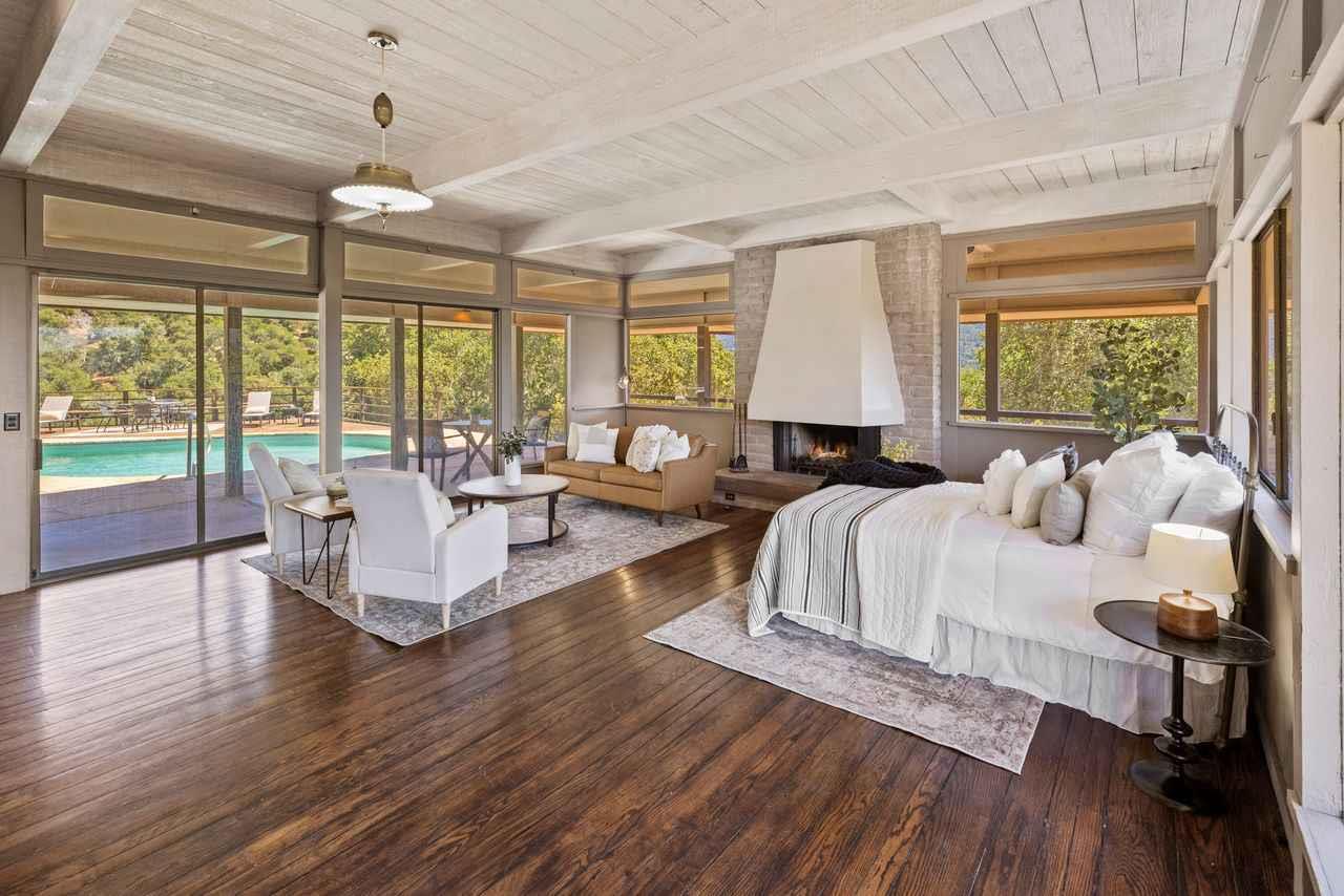 9 De Amaral Road Carmel Valley, CA 93924 - Photo 7 of 17 a living room with furniture and a large window