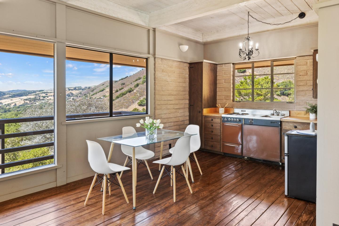 9 De Amaral Road Carmel Valley, CA 93924 - Photo 9 of 17 a view of a dining room with furniture window and wooden floor