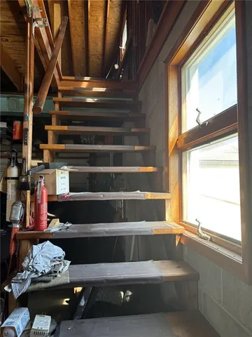 a view of staircase with wooden floor and stairs