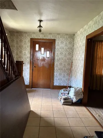 a view of house with backyard