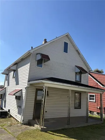 a front view of a house with garage