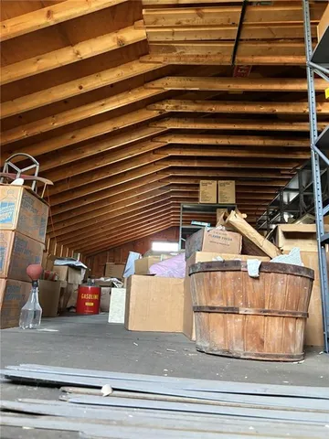 a view of living room with furniture and a fireplace