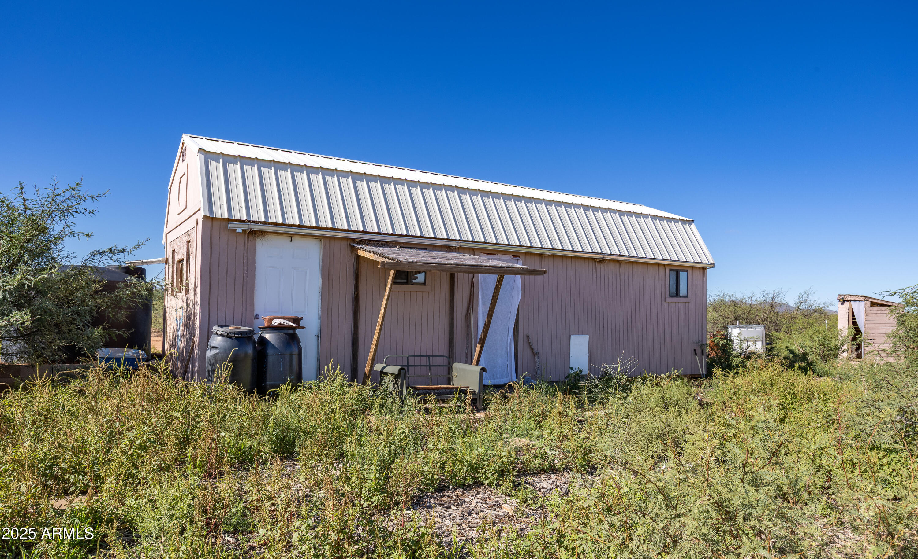 Tbd North Westward Trail, Unit 9 McNeal, AZ 85617 - Photo 20 of 37 a view of a house with many windows